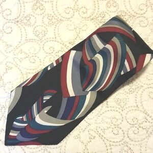 Givenchy Monsieur 100% silk tie. Multi-colored ribbon on black background. USA